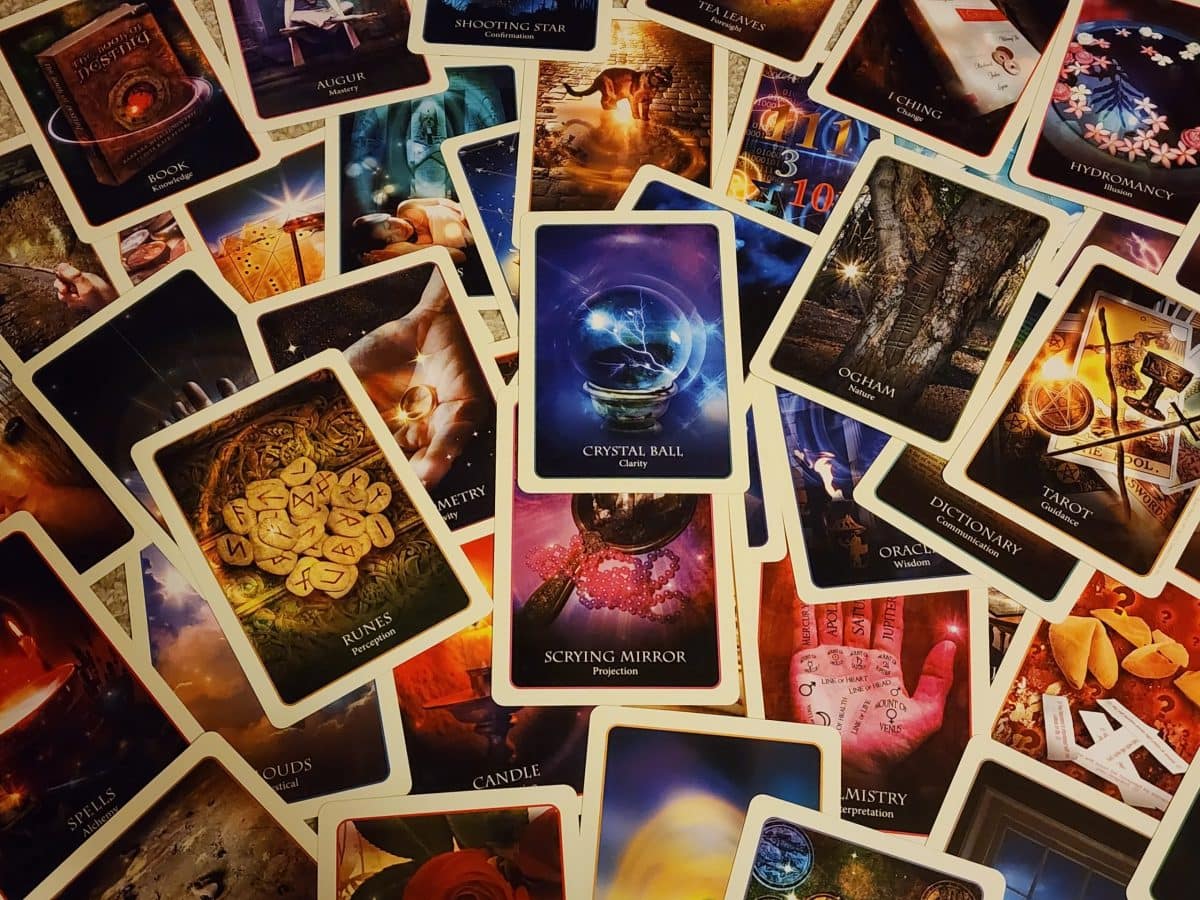 scattered oracle cards from the divination of the ancients deck