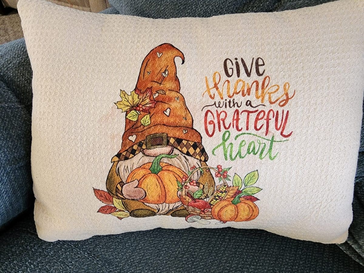 Gnome throw pillow that says give thanks with a grateful heart