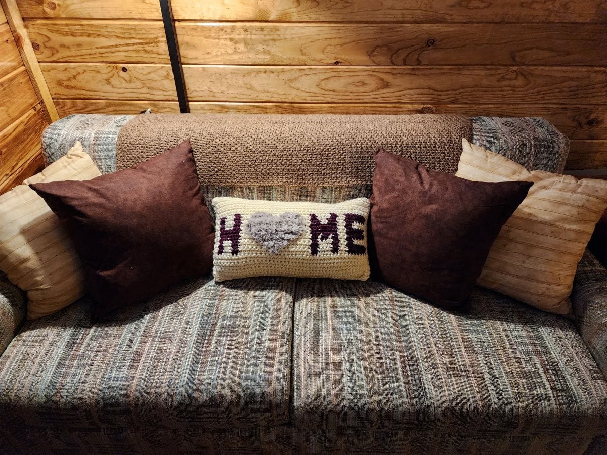 Sofa with finished Home Pillow in the center