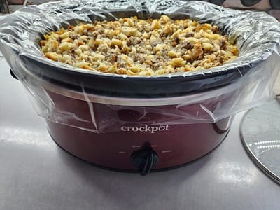 Crockpot filled to the brim with hamburger dressing
