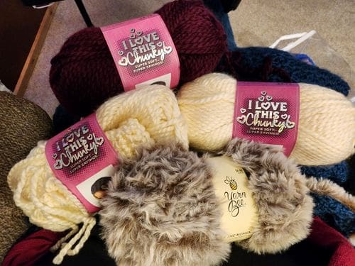 Three kinds of yarn - two are I Love This Chunky brand in Plumberry and Sand Frost, Third kind is Yarn Bee Fur the Moment yarn